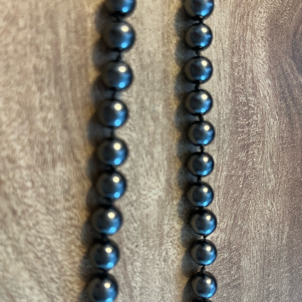 Beautiful genuine deep gray pearls. 24” with knots in between each. France.